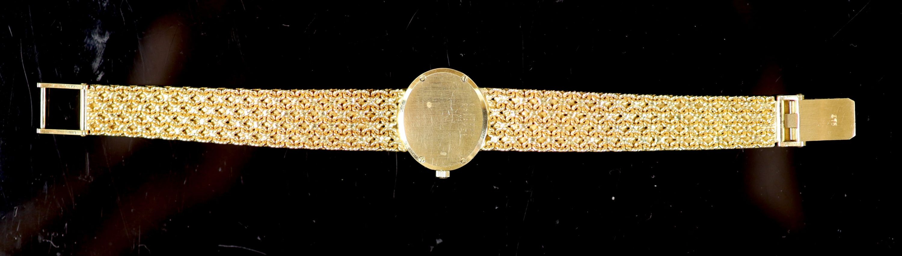 A lady's 18ct gold Baume & Mercier quartz oval dress bracelet wrist watch, with diamond set bezel
